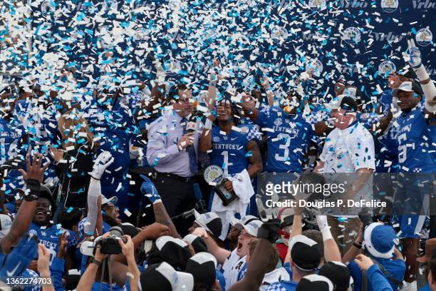 Wan'Dale Robinson of the Kentucky Wildcats is interviewed after receiving the MVP trophy and defeating Iowa Hawkeyes to win the Citrus Bowl at...