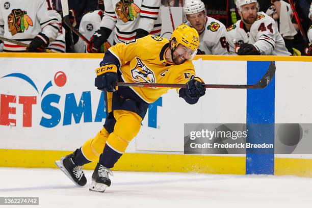 Roman Josi of the Nashville Predators fires a shot against the Chicago Blackhawksduring the third period at Bridgestone Arena on January 01, 2022 in...