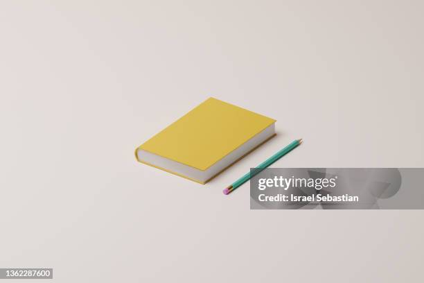 3d illustration. close up of a hardcover book and a pencil on isolated background with copy space. - model gefabriceerd object stockfoto's en -beelden