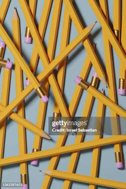 top view of a 3d illustration of a set of yellow pencils with eraser stacked on blue background. - 3d render pencils stockfoto's en -beelden