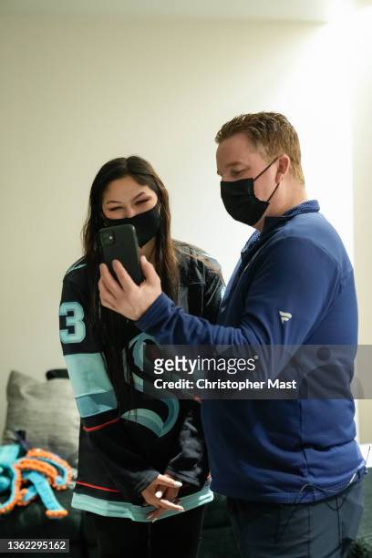 Seattle Kraken fan Nadia Popovici and Vancouver Canucks equipment manager Brian Hamilton meet before the game at Climate Pledge Arena on January 01,...