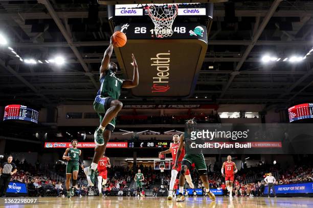 Sion James of the Tulane Green Wave attempts a layup in the second half against the Cincinnati Bearcats at Fifth Third Arena on January 01, 2022 in...