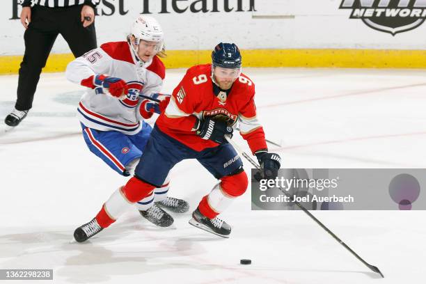 Sami Niku of the Montreal Canadiens xdefends against Sam Bennett of the Florida Panthers as he skates with the puck at the FLA Live Arena on January...