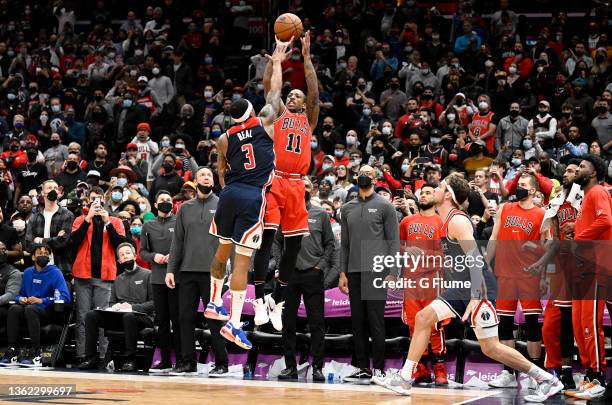 DeMar DeRozan of the Chicago Bulls hits the game winning shot in the fourth quarter over Bradley Beal of the Washington Wizards at Capital One Arena...