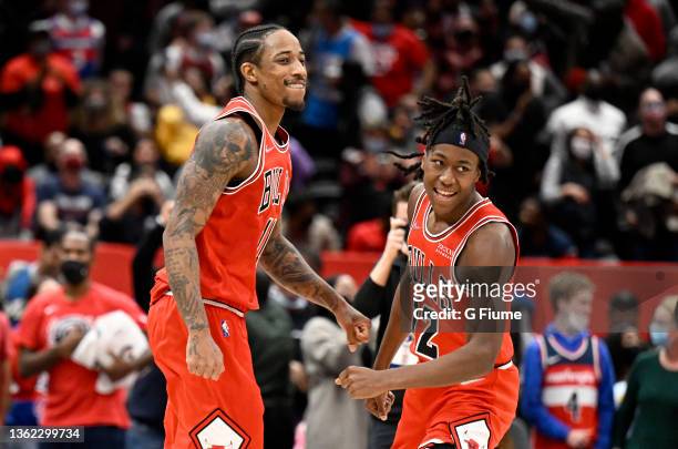 DeMar DeRozan of the Chicago Bulls celebrates with Ayo Dosunmu after hitting the game winning shot in the fourth quarter against the Washington...