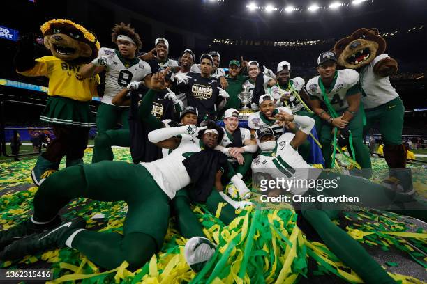 The Baylor Bears pose for a photo with the trophy after defeating the Mississippi Rebels 21-7 in the Allstate Sugar Bowl at Caesars Superdome on...