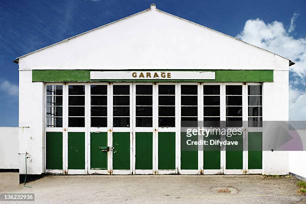 old deserted auto repair garage against blue sky - auto repair shop exterior stock pictures, royalty-free photos & images