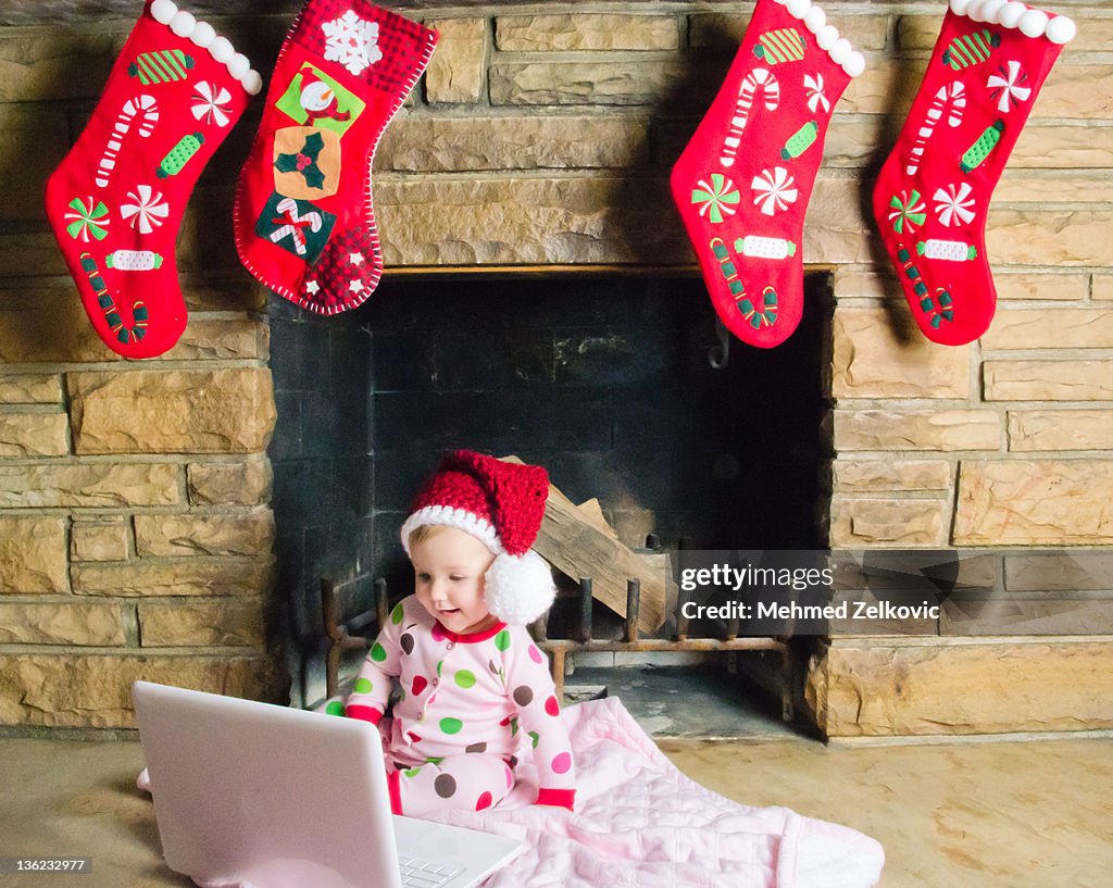 Baby girl wearing santa hat