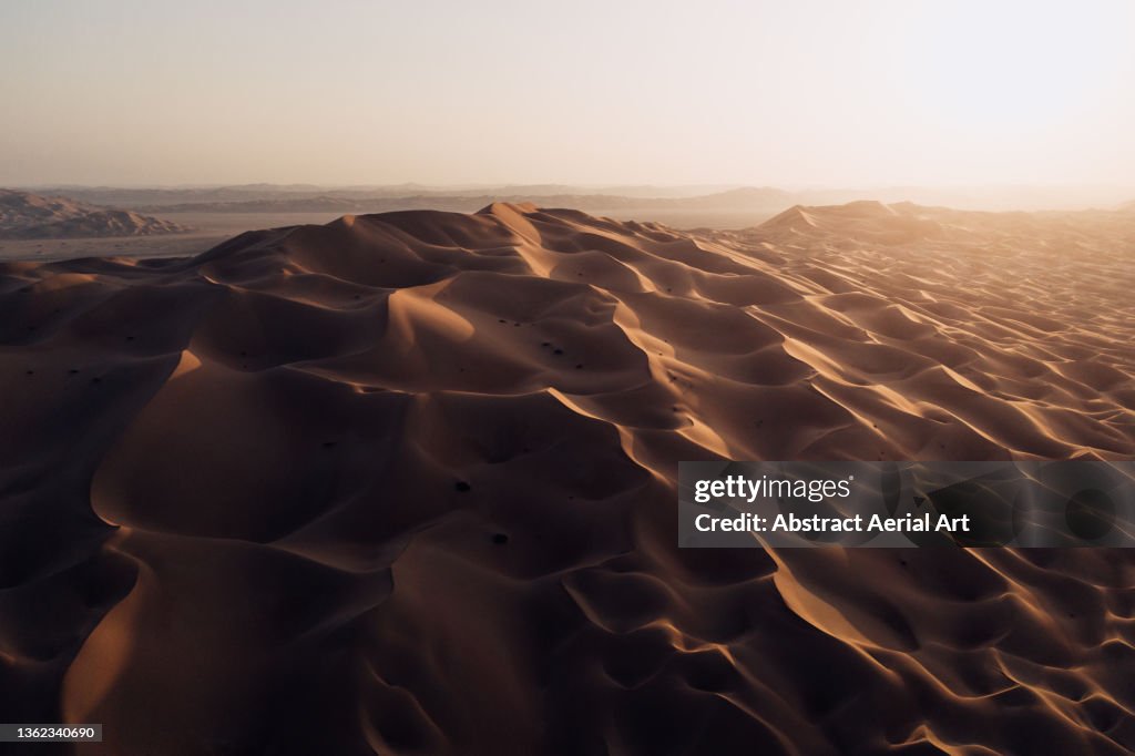 Drone image showing a sand dune in the desert at sunset, Abu Dhabi, United Arab Emirates