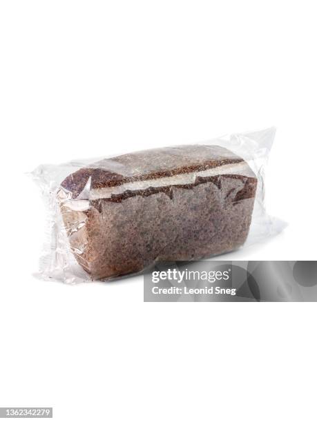loaf of bread from rye flour in clean transparent plastic pack side view on a white background isolated closeup with clipping path. selective focus - flour packaging stock pictures, royalty-free photos & images