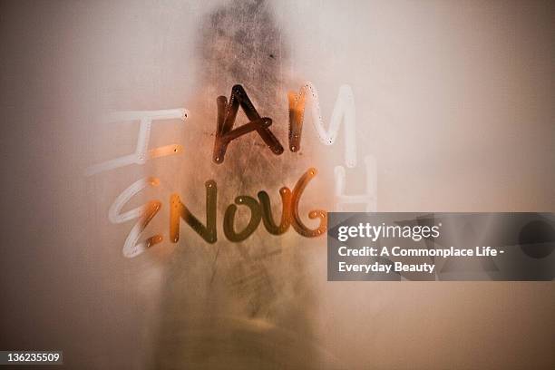i am enough written on steamy mirror - mirror steam stockfoto's en -beelden