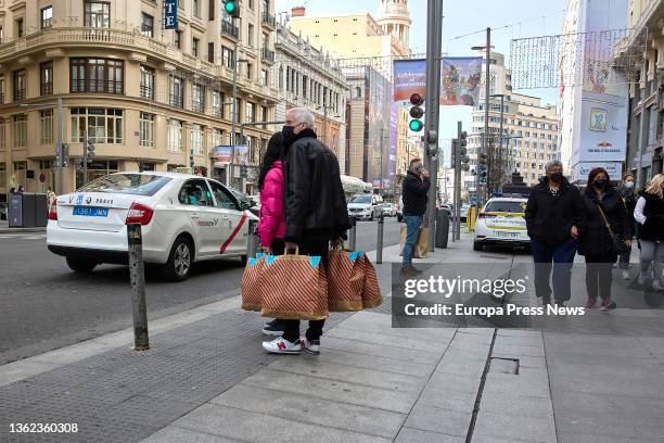 Several people on Gran Via street in Madrid, on 02 January, 2022 in Madrid, Spain. The January sales begin and will generate 14% more employment,...