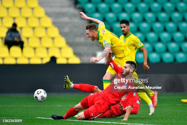 Willem Geubbels of FC Nantes is tackled as he shoots on goal during the French Cup match between Amicale Sportive de Vitre and FC Nantes on January...