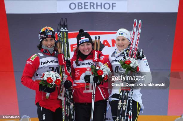 Marit Bjoergen of Norway, Justyna Kowalczyk of Poland and Hanna Brodin of Sweden pose after the FIS Tour de Ski Oberhof Women's Prolouge at DKB Ski...