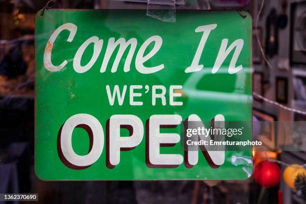 "open" sign hanging on a store window. - izmir shopping stock pictures, royalty-free photos & images