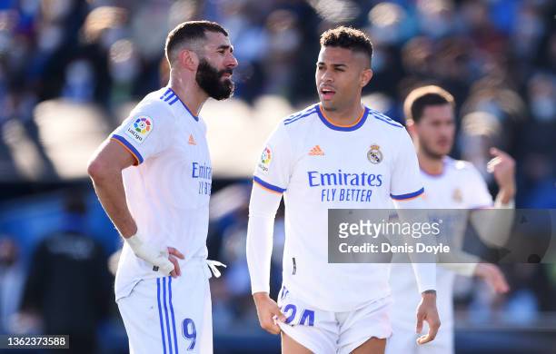 Karim Benzema and Mariano of Real Madrid react at the full time whistle after the LaLiga Santander match between Getafe CF and Real Madrid CF at...