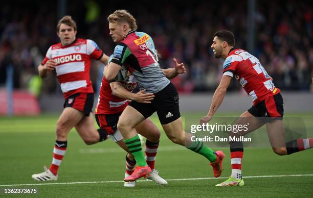 Louis Lynagh of Harlequins is tackled by \g15 during the Gallagher Premiership Rugby match between Gloucester Rugby and Harlequins at Kingsholm...