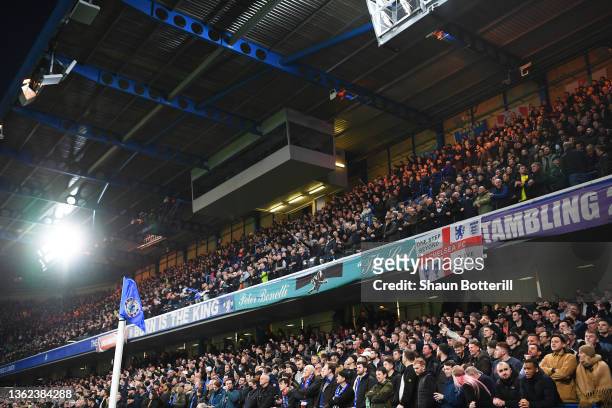 Fans of Chelsea look on from the safe standing area of the stadium during the Premier League match between Chelsea and Liverpool at Stamford Bridge...