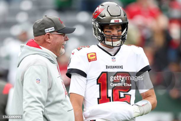 Tom Brady of the Tampa Bay Buccaneers and head coach Bruce Arians talk during warm ups prior to the game against the New York Jets at MetLife Stadium...