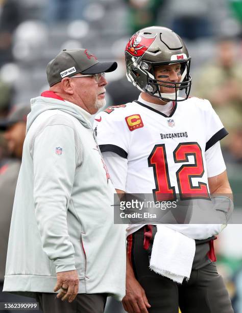 Tom Brady of the Tampa Bay Buccaneers and head coach Bruce Arians talk during warm ups prior to the game against the New York Jets at MetLife Stadium...