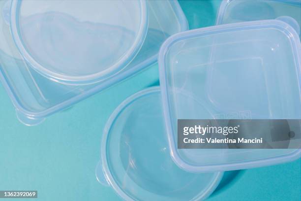 five plastic containers on turquoise background - transparent box stock pictures, royalty-free photos & images