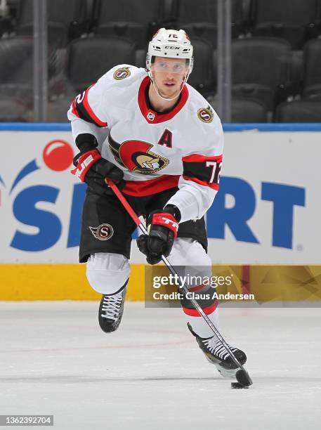 Thomas Chabot of the Ottawa Senators skates with the puck against the Toronto Maple Leafs during an NHL game at Scotiabank Arena on January 1, 2022...