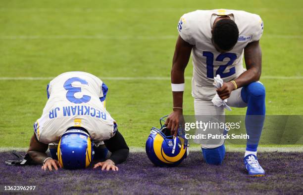 Odell Beckham Jr. #3 and Van Jefferson of the Los Angeles Rams kneel before the game against the Baltimore Ravens at M&T Bank Stadium on January 02,...