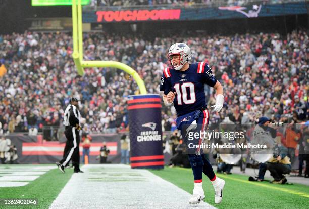 Mac Jones of the New England Patriots reacts after a touchdown in the first quarter of the game against the Jacksonville Jaguars at Gillette Stadium...