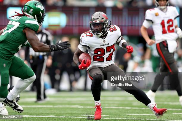 Ronald Jones of the Tampa Bay Buccaneers carries the ball against C.J. Mosley of the New York Jets during the second quarter of the game at MetLife...
