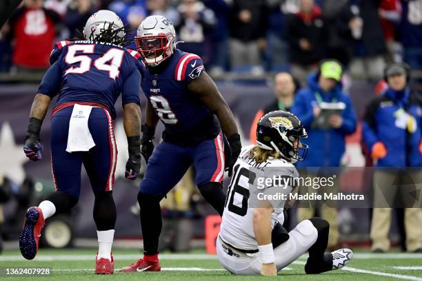 Dont'a Hightower of the New England Patriots celebrates getting a sack with teammate Ja'Whaun Bentley in the first quarter of the game against the...
