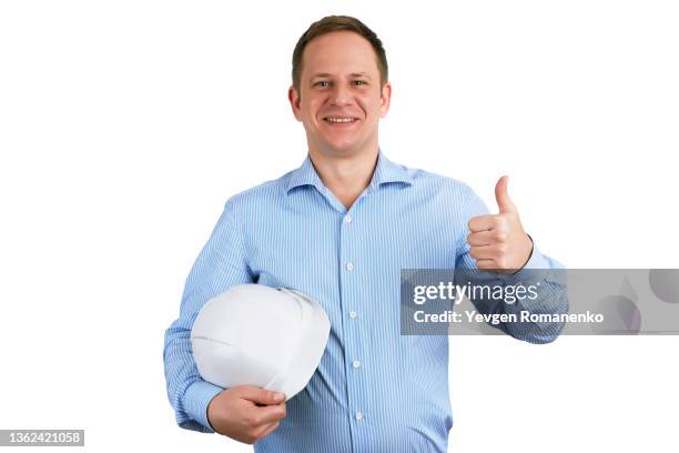 construction worker with helmet in hand showing thumbs up isolated on white background - pouce levé fond blanc photos et images de collection