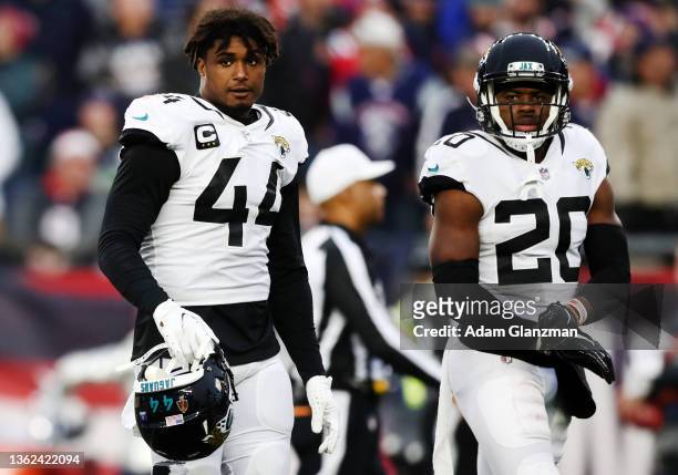 Myles Jack and Daniel Thomas of the Jacksonville Jaguars react after an interception in the third quarter of the game against the New England...