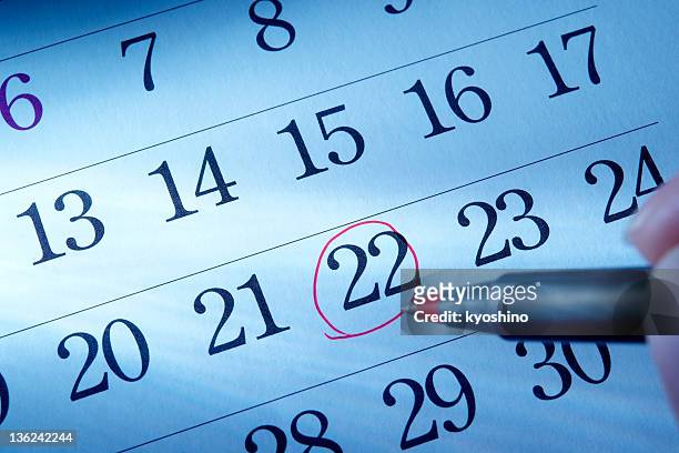 hand writing a red round mark of a calendar - todays agenda stock pictures, royalty-free photos & images