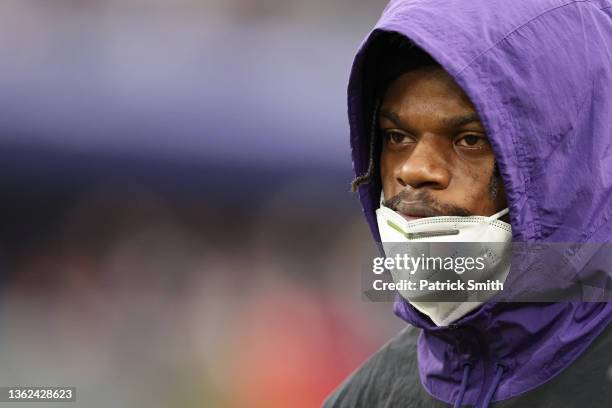 Lamar Jackson of the Baltimore Ravens looks on from the sidelines in the third quarter of the game against the Los Angeles Rams at M&T Bank Stadium...