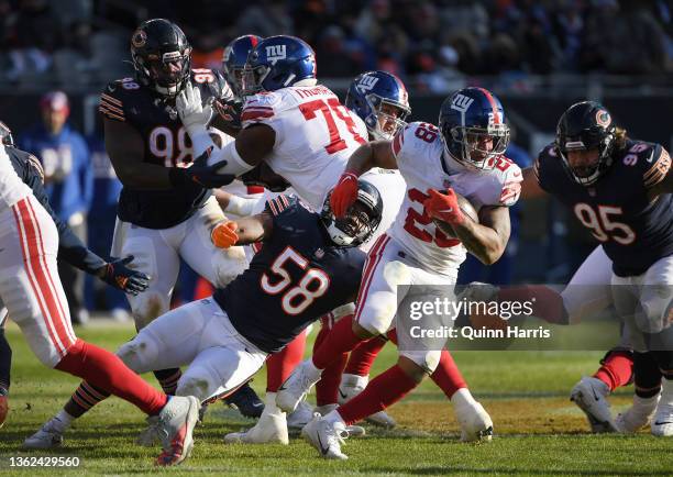 Devontae Booker of the New York Giants runs with the ball in the third quarter of the game against the Chicago Bears at Soldier Field on January 02,...