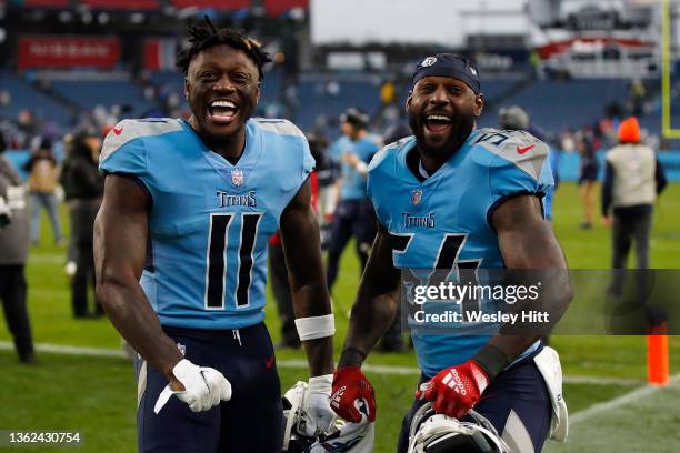 Brown and Rashaan Evans of the Tennessee Titans celebrate after defeating the Miami Dolphins 34-3 at Nissan Stadium on January 02, 2022 in Nashville,...