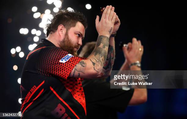 Michael Smith of England reacts to the win during his Semi-Finals Match against James Wade of England during Day Fifteen of The William Hill World...