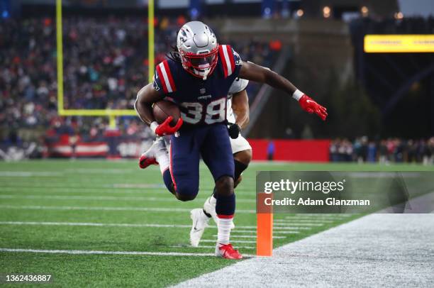 Rhamondre Stevenson of the New England Patriots runs into the endzone for a touchdown in the fourth quarter of the game against Jacksonville Jaguars...