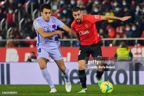 Dani Rodriguez of RCD Mallorca and Eric Garcia of FC Barcelona competes for the ball during the LaLiga Santander match between RCD Mallorca and FC...