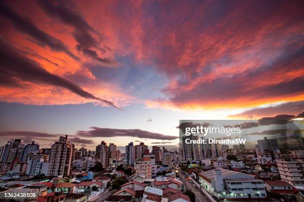 sunset over buildings in florianópolis. - romantic sky stock pictures, royalty-free photos & images
