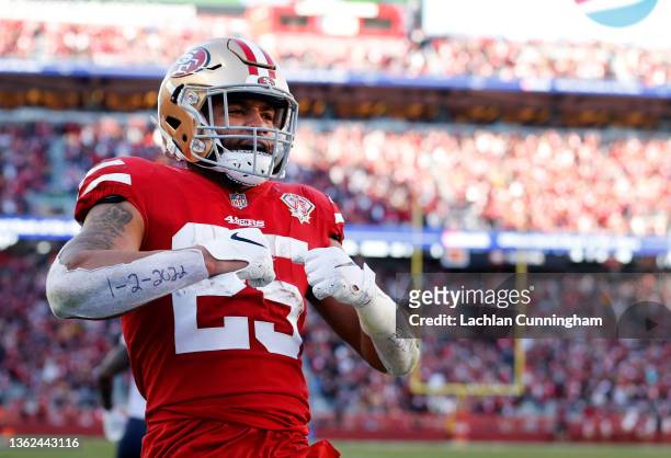 Eli Mitchell of the San Francisco 49ers reacts after scoring a touchdown in the third quarter of the game against the Houston Texans at Levi's...