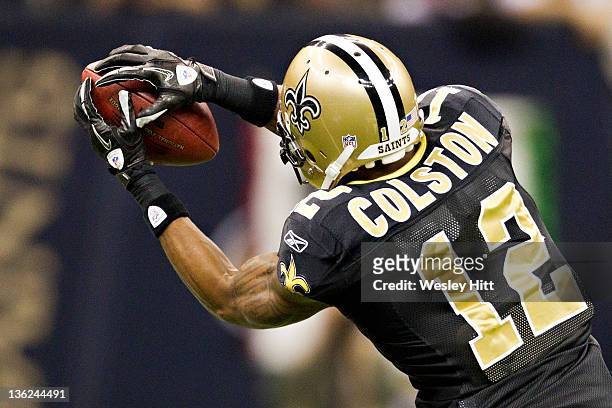Marques Colston of the New Orleans Saints catches a pass against the Atlanta Falcons at Mercedes-Benz Superdome on December 26, 2011 in New Orleans,...