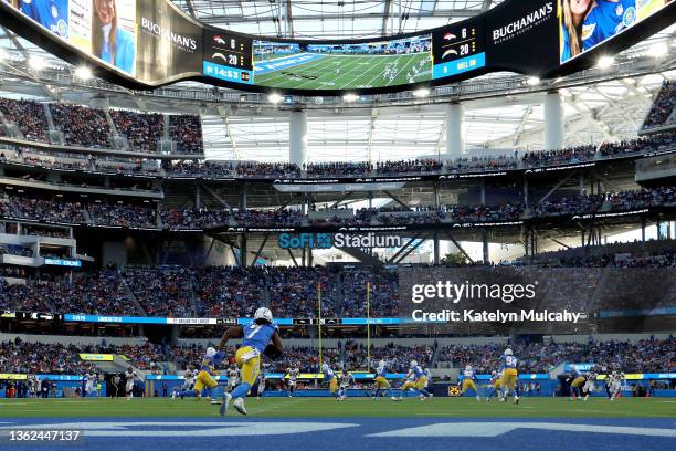 Andre Roberts of the Los Angeles Chargers returns a kick-off for a 101-yard touchdown in the fourth quarter of the game against the Denver Broncos at...