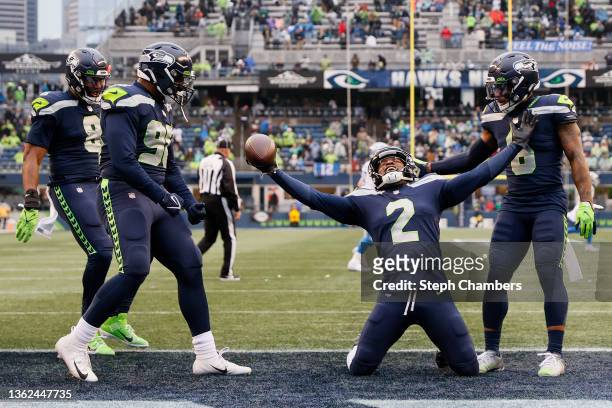 Reed of the Seattle Seahawks celebrates his interception with teammates during the third quarter against the Detroit Lions at Lumen Field on January...