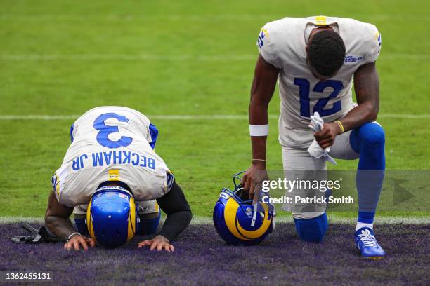 Odell Beckham Jr. #3 and Van Jefferson of the Los Angeles Rams kneel in the end zone before playing against the Baltimore Ravens at M&T Bank Stadium...