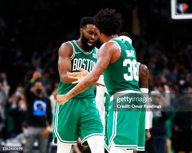 Marcus Smart and Jaylen Brown of the Boston Celtics react during the fourth quarter against the Orlando Magic at TD Garden on January 02, 2022 in...