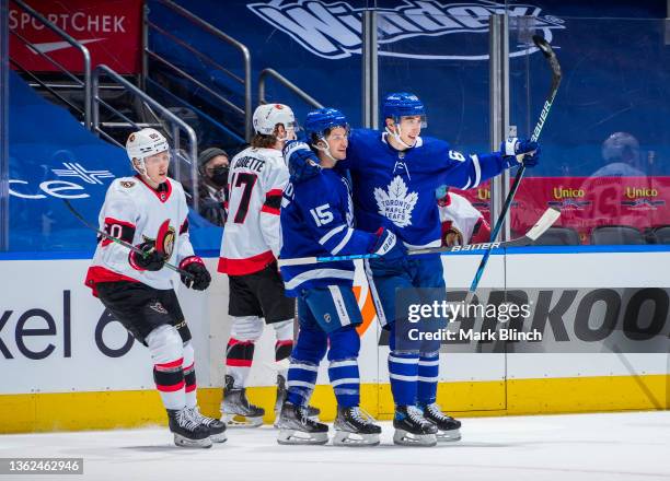 Ilya Mikheyev of the Toronto Maple Leafs celebrates his goal with Alexander Kerfoot against the Ottawa Senators during the first period at the...