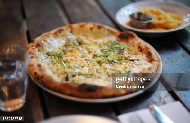 pizza and fried potato in a restaurant - kamakura city stock pictures, royalty-free photos & images