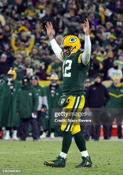 Quarterback Aaron Rodgers of the Green Bay Packers celebrates after a touchdown during the 3rd quarter of the game against the Minnesota Vikings at...
