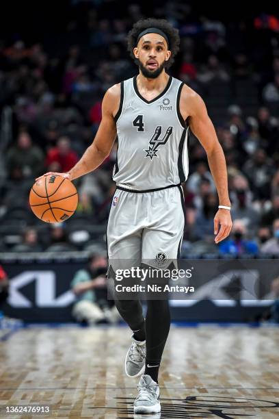 Derrick White of the San Antonio Spurs handles the ball against the Detroit Pistons at Little Caesars Arena on January 01, 2022 in Detroit, Michigan....